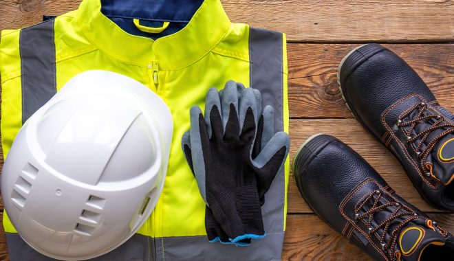 Flat lay, tablet and builder uniform items, builder work and repair concept.